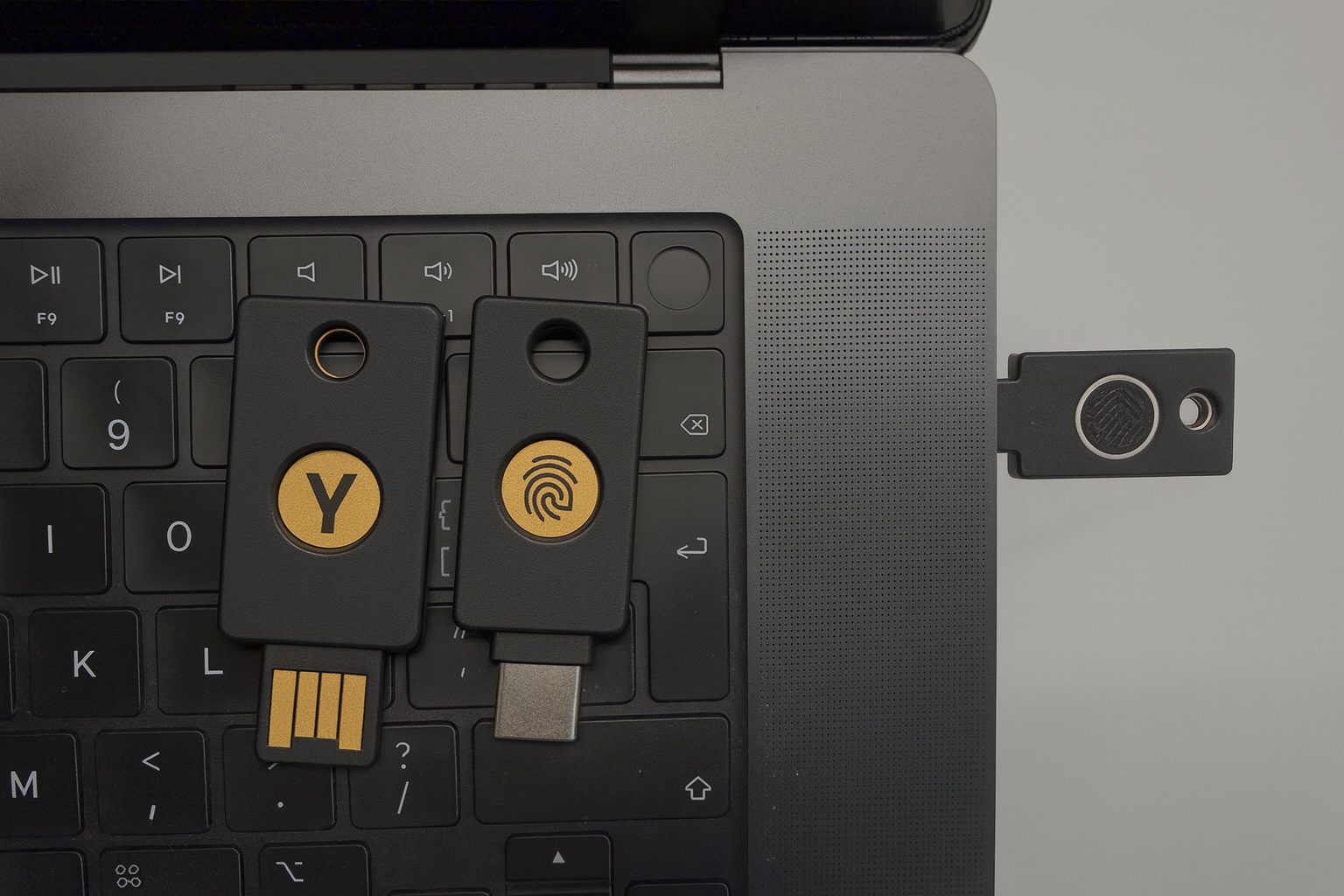 Shows different passkey options with an Apple laptop.